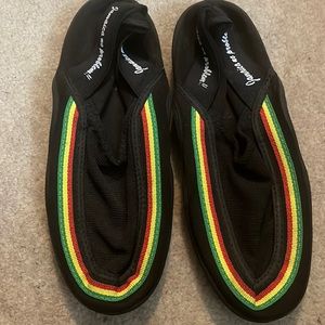 Worn once swim shoes with Jamaica colors